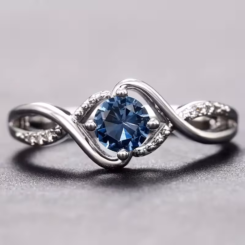 A Minimalist Wave-shaped Blue Synthetic Zirconia Ladies' Ring For Parties, Dances, Daily Wear, And Jewelry Gifts.